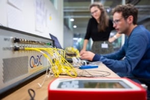 Photo of the reconfigurable photonic quantum processor in a rack-mountable case with optical fibres coming out of it