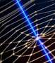 An artificial spiderweb probed with a laser