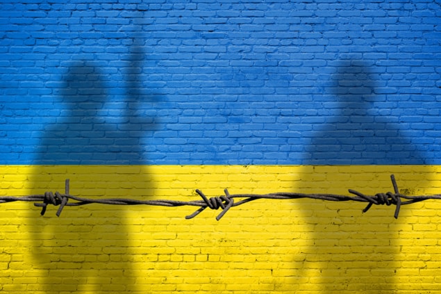 Ukraine flag with soldier shadows