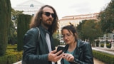 Two tourists looking at a phone