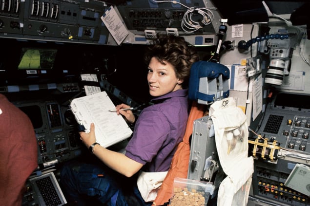 Eileen Collins in the pilot seat of the Space Shuttle Discovery