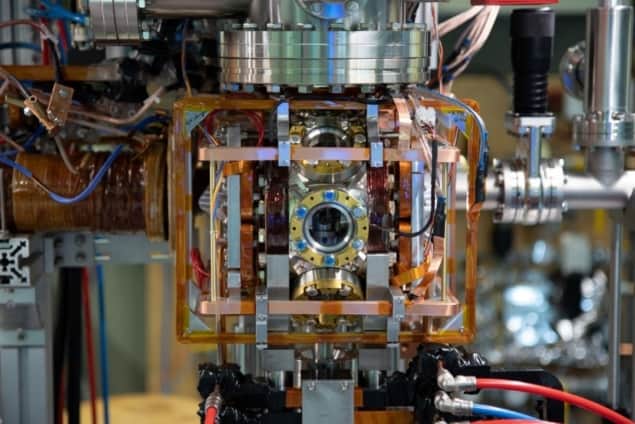 Photo of the experimental chamber showing part of the ion microscope inside a vacuum chamber and surrounded by coils of wire