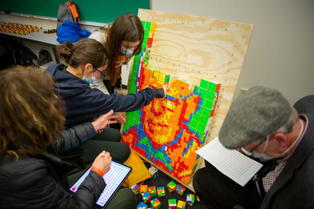 Delegates to G4G14 making a portrait of Martin Gardner from Rubik’s cubes