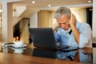 older man frustrated with remote working