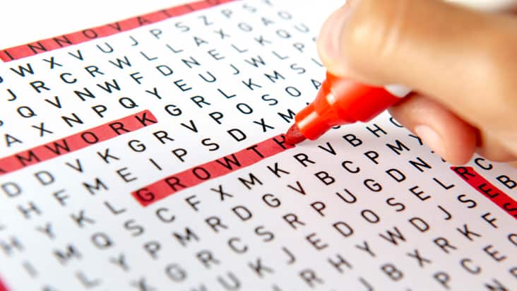 Someone finding words in a word search