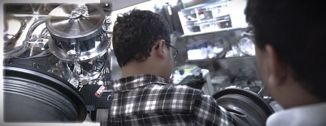 Photo of researchers working in a glovebox