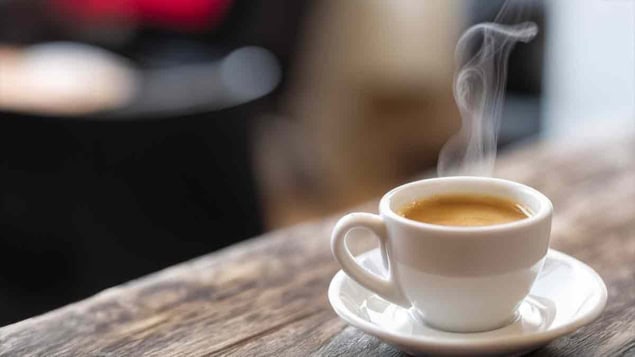 Close-up of a refreshing hot cup of a coffee at a cafe.