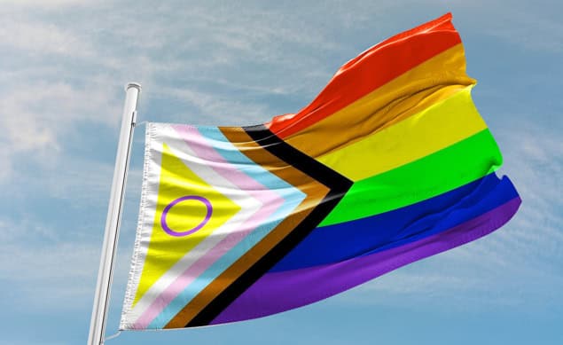 Progress Pride flag flying outside