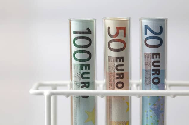 European bank notes in a test tube holder