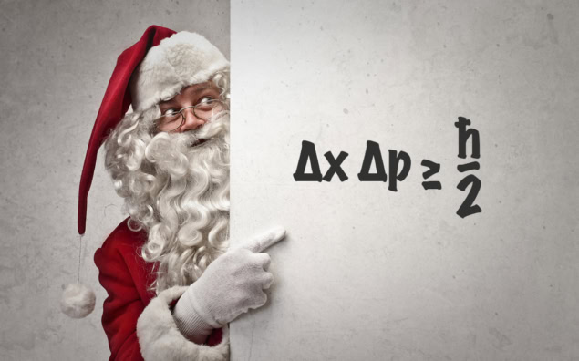 Santa pointing at a whiteboard where the uncertainty principle has been written