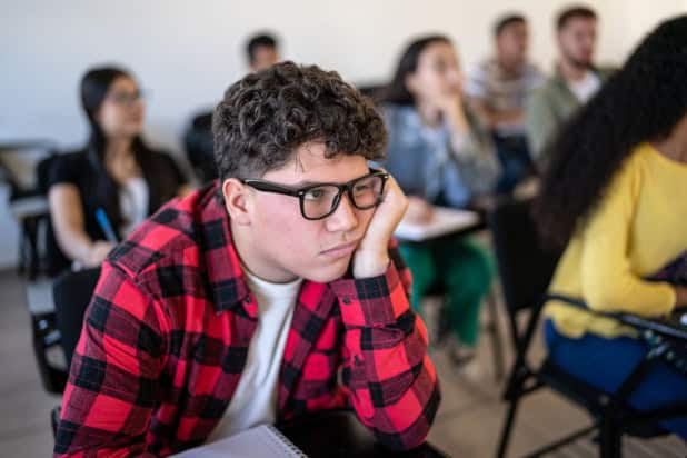 Bored young man in the classroom