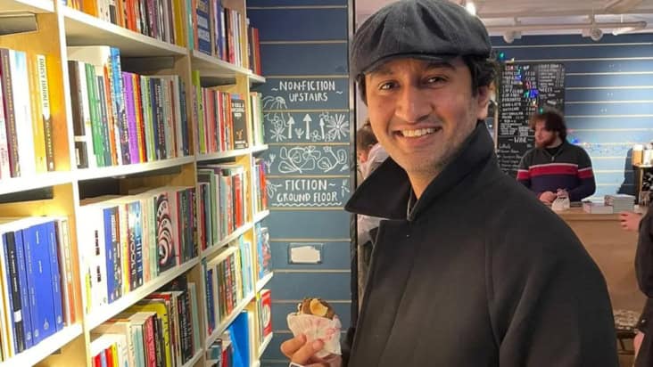 Muhammad Hamza Waseem standing in a bookshop
