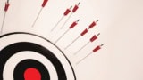 Illustration of arrows missing an archery target