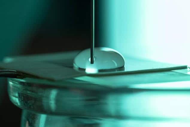 water droplets A water droplet spreading and contracting on a flat plate of Teflon