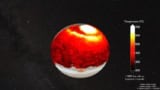 White-to-black heat map of the planet Jupiter superimposed against a photograph of the planet and against a dark, starry background. The planet's north pole is bright white, the equatorial regions tend towards black, and most of the middle latitudes are red except for a wide arc of yellow about 1/3 of the way from north pole to equator. The southernmost latitudes are not included in the heat map. A scale at right indicates that white areas are 700 degrees Celsius, yellow areas are 600, red areas are 500-300, and black areas are 200. A note adds that these temperatures are measured 1000 km above the planet's surface.