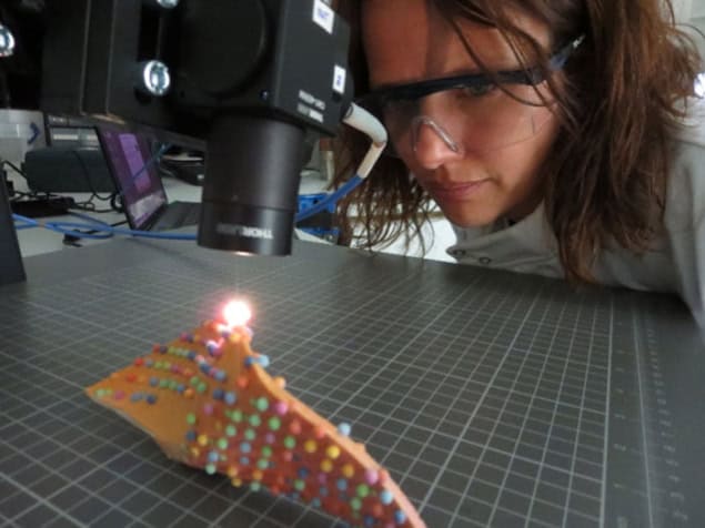 Woman using a nanotechnology microscope Woman using a nanotechnology microscope