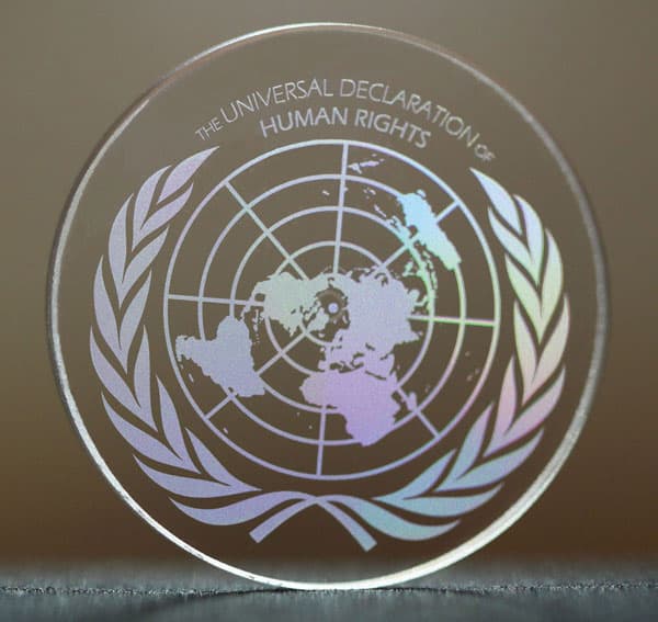 Glass disc with the Universal Declaration of Human Rights logo