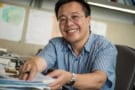 Photo of Qimiao Si working in his office