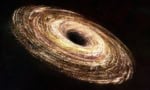 Artist's impression of a black hole showing the dark event horizon and a bright accretion disk swirling around it
