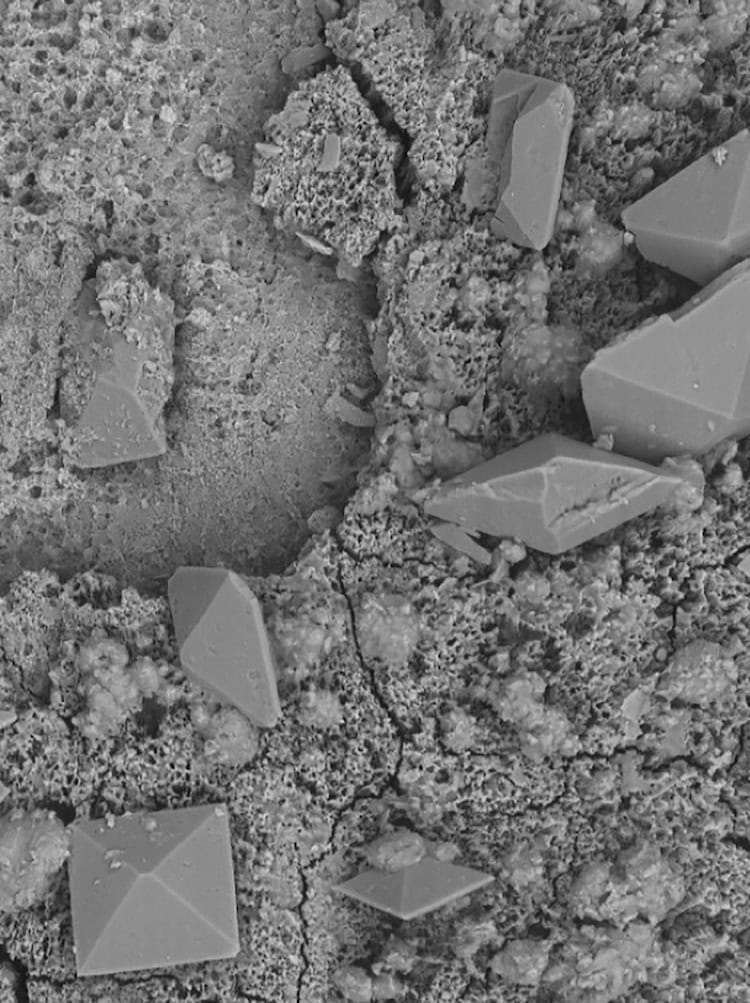 Microscope image showing square and diamond shapes in various shades of grey