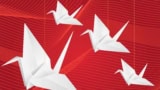 Origami paper cranes on abstract red background