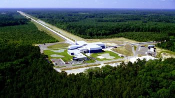 Aerial photo of a scientific facility with two long "arms" at right angles