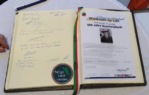Photo of book with signatures of Nobel laureates at the Helgoland 2025 meting.