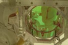 Scientist in protective clothing in a laboratory