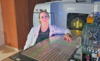 Medical physicist Jacqueline Andreozzi next to a linac