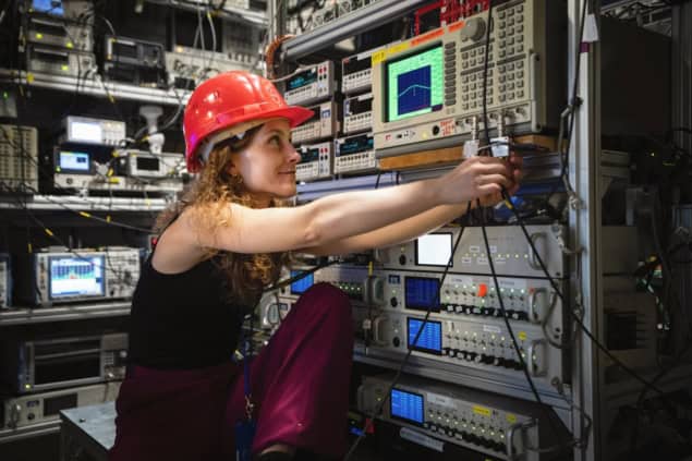 Photo of a physicist working at the BASE experiment