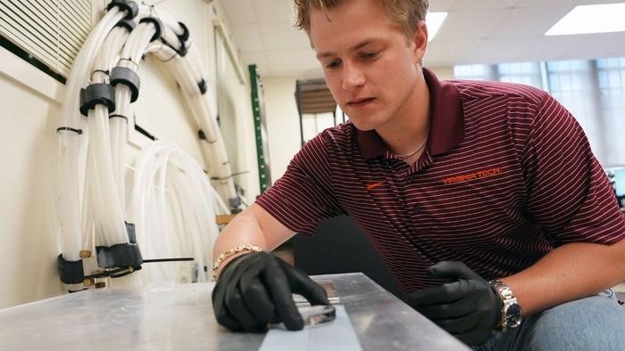Photo of a researcher who is adjusting an ice disc