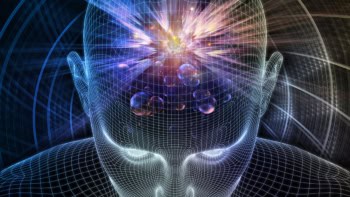 computer graphic of human skull superimposed with colourful representation of quantum physics