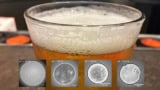 Glass of beer with foamy top