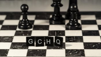 GCHQ spelt out in Scrabble pieces on a chess board