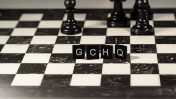 GCHQ spelt out in Scrabble pieces on a chess board