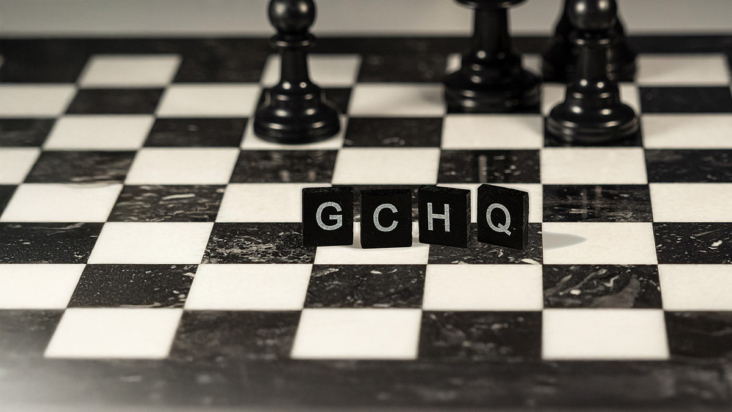 GCHQ spelt out in Scrabble pieces on a chess board