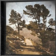 A photo of the Matterhorn rising above an Alpine landscape. The colours are a little washed out, but do not appear artificially tinted