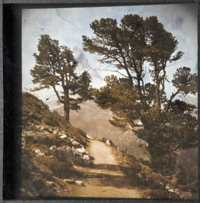 A photo of the Matterhorn rising above an Alpine landscape. The colours are a little washed out, but do not appear artificially tinted