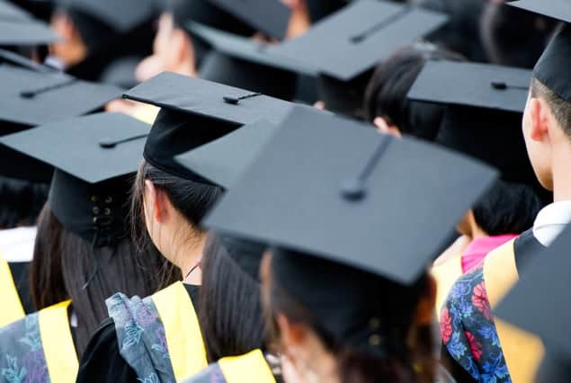 University students at graduation wearing mortarboards