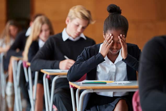Students struggling in an exam Students struggling in an exam