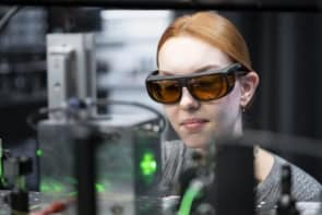 Photograph of the optical-tweezers and a member of the research team