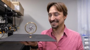 Photograph of Jeremy Munday and the Stirling engine