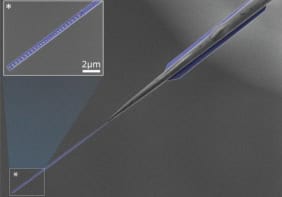 Electron microscope image of the superfluid wave tank used in the experiments coupled to an optical fibre which brings laser light in and out of the device