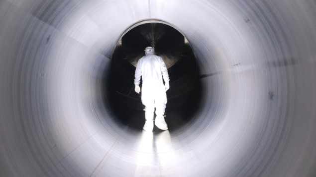 Photo of a worker inside KATRIN during the construction phase