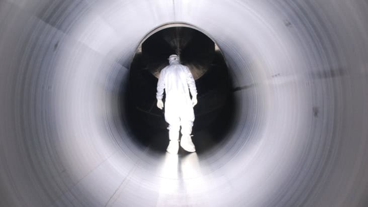 Photo of a worker inside KATRIN during the construction phase