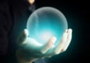 Hand holding a crystal ball