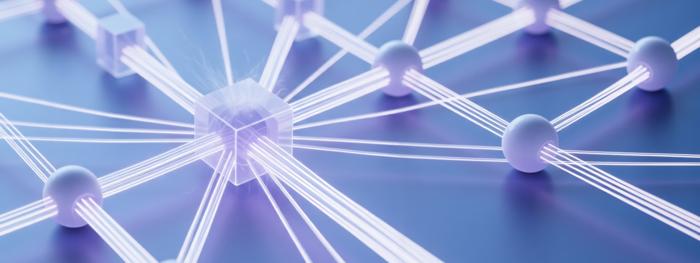 Conceptual image showing glowing semi-transparent boxes linked together in a grid