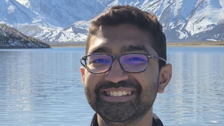 Photo of Rahil Makadia at an alpine lake