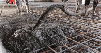 Concrete floor being poured on a building site