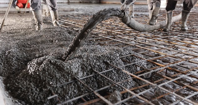 Concrete floor being poured on a building site